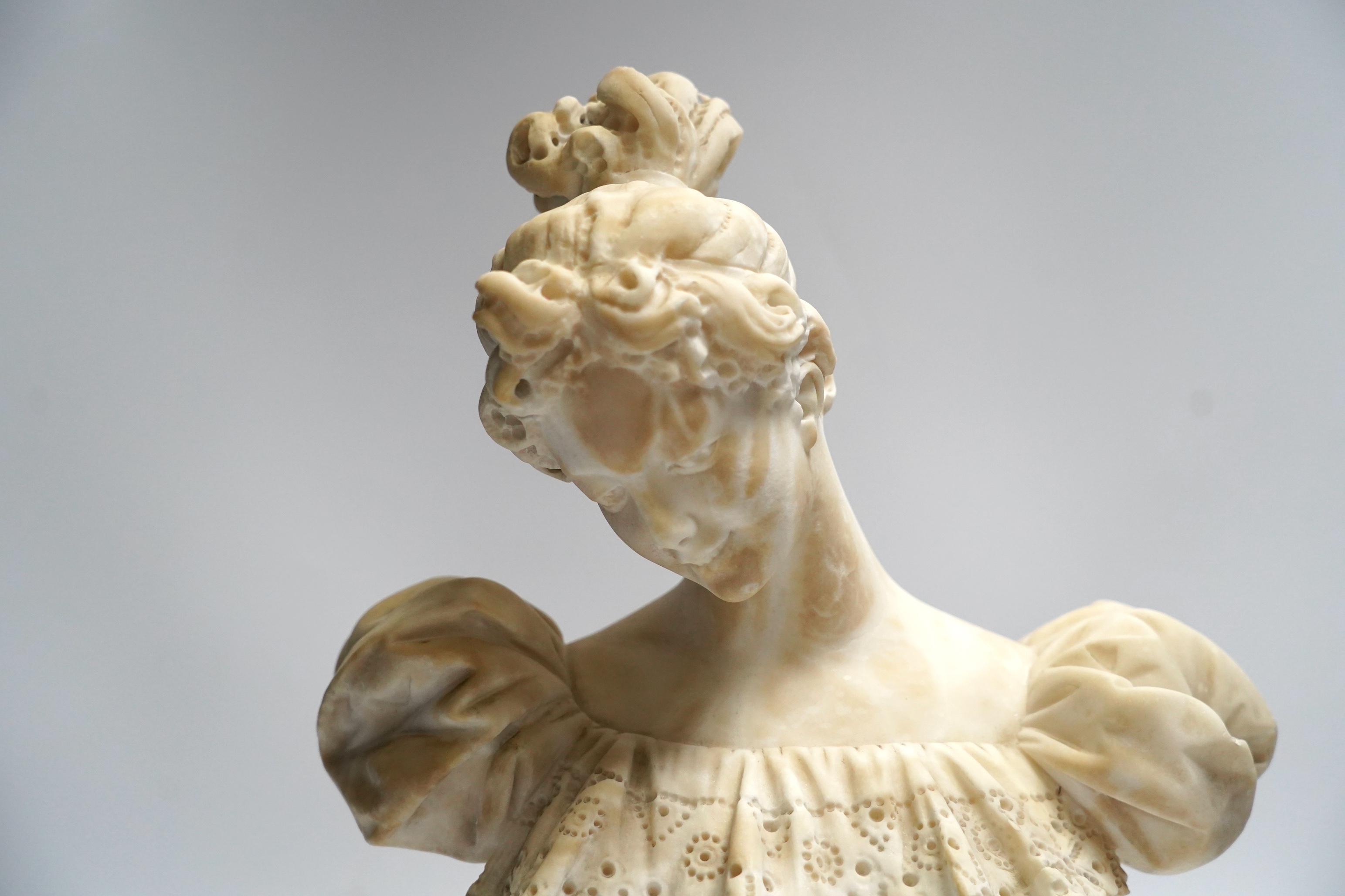 A late 19th century carved alabaster bust of a young woman, 40cm high